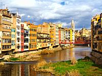 Colourful houses along the banks River Onyar in the old town of Girona - Spain.