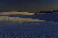 Dunes seen as the sun is setting and the blue hour approaches.