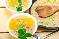 Hearty Middle Eastern Chickpea and Barley Soup with mint leaves on top.