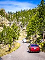 Cars on the Needles Highway in Custer State Park in the Black Hills of South Dakota USA.