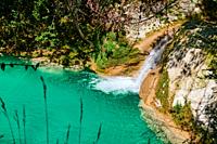 Turquoise waters in the Urederra river, Baquedano, Navarra, Spain, Europe.