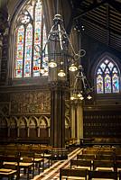 All Saints Church, a Grade I listed Anglo-Catholic church designed by William Butterfield in High Victorian Gothic style and built in 1850s, London, U...