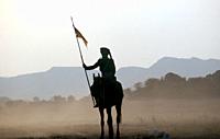 Silhouette of a rider in ceremonial dress ( Rajasthan, India).