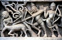 Bas relief depicting a scene from the hindu mythology ( Shamlaji, Gujarat, India). Carving on the outer wall of a 15th-16th centuries temple dedicated...