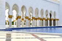 A colonnade at Sheikh Zayed Mosque. Abu Dhabi, United Arab Emirates.