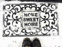 Finding my way home in fresh snow. Man standing at the edge of a welcoming doormat. The dead of winter. Approaching, hesitant, hesitating, steps..