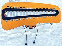 Musical instrument for children, outdoors, in fresh snow, Ontario, Canada. Concept: make music in all seasons, Commune with nature.