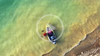 Young couple paddling an inflatable canoe in a swamp. Drone view. 4K. Alloz reservoir, Navarra, Spain, Europe