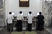 Pyongyang, North Korea, Asia - Men in front of computers use the intranet at the Grand People's Study House, the central library located in the North ...