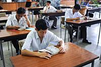 Pyongyang, North Korea, Asia - Students sit inside the reading room at the Grand People's Study House, the central library located in the North Korean...