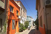 Motorcyclist in front of the traditional Greek-Ottoman houses at the center of ancient Kydonies todays Ayvalik town, Balikesir, Aegean Region, Turkey,...