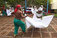 Dancers in traditional dress during a performance at Casa De La Trova in the city center, Santiago De Cuba, Cuba, Central America.