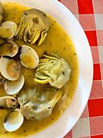 Artichokes and clams in green sauce. Spain.