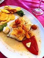 Grilled hake loin with vegetables. Spain.