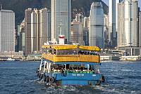 Hong Kong Star ferry carrying passengers across Victoria Harbour.