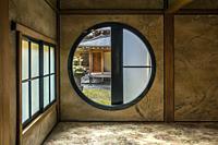 Courtyard seen through the round window in Tamozawa Imperial villa.