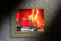 Cozy Scene Near Fireplace With Cup Of Hot Tea and Book Inside of Classic Frame.