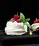 Baked cake made from whipped chicken protein and cream, decorated with fresh berries. 	.