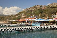 View of the piers in front of the houses and local restaurants in Kalekoy, Ucagiz village, Demre, Antalya Province, Mediterranean Coast, Ancient Lycia...