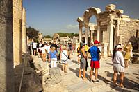 Tourists on Curetes Street in front of the Hadrian Temple at the Roman ruins of Ephesus, Efes, Selcuk, Kusadasi, Izmir District, Aegean Region, Turkey...