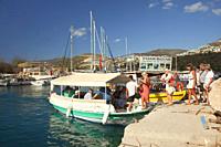 Tourists getting on a daily excursion boat for a trip, Kalkan village, Antalya Province, Mediterranean Coast, Ancient Lycia Region, Turkish Riviera, T...