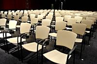 View of the empty chairs in an auditorium.