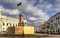 Ukrainian flag on the site of the former monument to Catherine the Great in Odessa, Ukraine, on a sunny day.