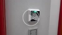 A contactless and electronic door opener with a hand.