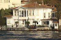 Fishing boat in front of the traditional seaside residence or so-called waterside mansion of Nuri Pasa Yalisi in Kanlica village, a neighbourhood on t...