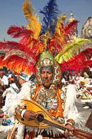 Indigenous people wearing mask and traditional clothing performing during the celebrations in front of the Basilica on the festival day dedicated to O...