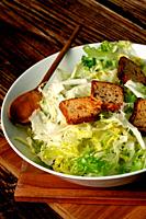 Fresh endive salad with toasted bread rolls.