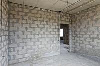 Construction of an individual residential building, view of the walls of the room, a doorway in the wall.