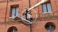 Rovigo, Italy 29 july 2022: Man building crane maintenance
