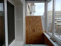 Warming and cladding with slabs of a balcony in an the apartment house.