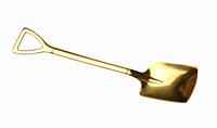 Empty yellow metal spoon on a white isolated background.