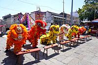 George Town, Penang, Malaysia - Jan 15 2022: Different color Chinese lion dance perform in hot sunny day at consecration ceremony.