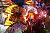 George Town, Penang, Malaysia - Jan 22 2022: Different colorful Chinese fan with the sun light at back.