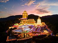 Ayer Itam, Penang, Malaysia - Feb 19 2022: Kek Lok Si temple with beauty led light decoration during sunset hour.