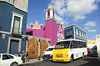 Local people and vehicles in front of the Capilla Del Cireneo Church in El Alto district at the historic center, Puebla, Puebla State, Mexico, Central...