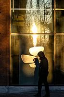 Copenhagen, Denmark A person walking in the historic Carlsberg Byen district in the morning light.