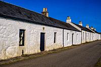 A row of cottages in the main settlement on the Island of Coll, Scotland - the village of Arinagour.