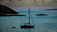 A lone yacht off the coast of Coll, Scotland.