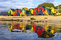 Colorful beach hut reflections at St. James Beach near Cape Town, South Africa.