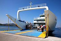 Agiokampos, Evia island, Greece - August 15, 2023: People on summer vacation entering ferryboat at Agiokampos, Evia ilsand. Concept of transportation ...