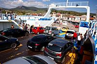 Glyfa village, Greece - August 15, 2023: Vehicles and people travelling from Evia island exiting ferryboat at the harbour of Glyfa in Greece.