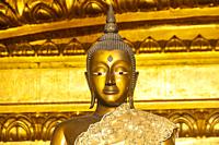 Golden Buddha inside the Buddhist temple Wihan Phra Mongkhon Bophit in the World Heritage historic city Ayutthaya, Thailand.