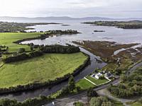 typical house and road next to Bantry Bay, Beara Peninsula, Adrigole, Beara Peninsula, County Cork, Ireland, United Kingdom.