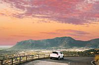 Terracina, Italy. White Color Car On Road On Background Beautiful Landscape With Mountains In Italy.