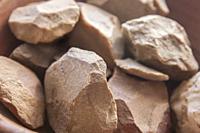 Quartzite pebbles from alluvial terraces of Vegas Altas del Guadiana, Orellana la Vieja, Badajoz. Selective focus.