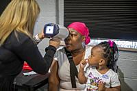 Detroit, Michigan - The OneSight Foundation organized a free clinic that offered eye exams and prescription glasses for low-income residents. OneSight...